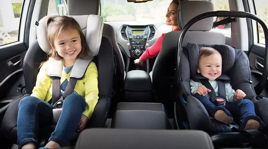 What is the difference between rear-facing and forward-facing baby car seats, and when should I transition my child between them?